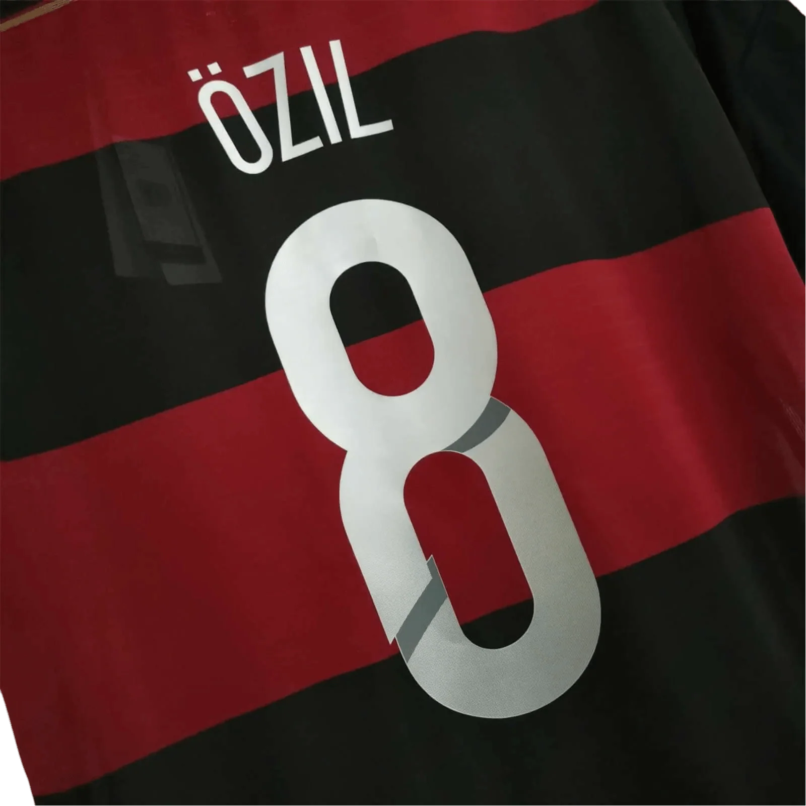 https://cdn.shopify.com/s/files/1/0826/7228/8075/files/2014-germany-away-black-red-retro-kit-589665.webp?v=1741197025