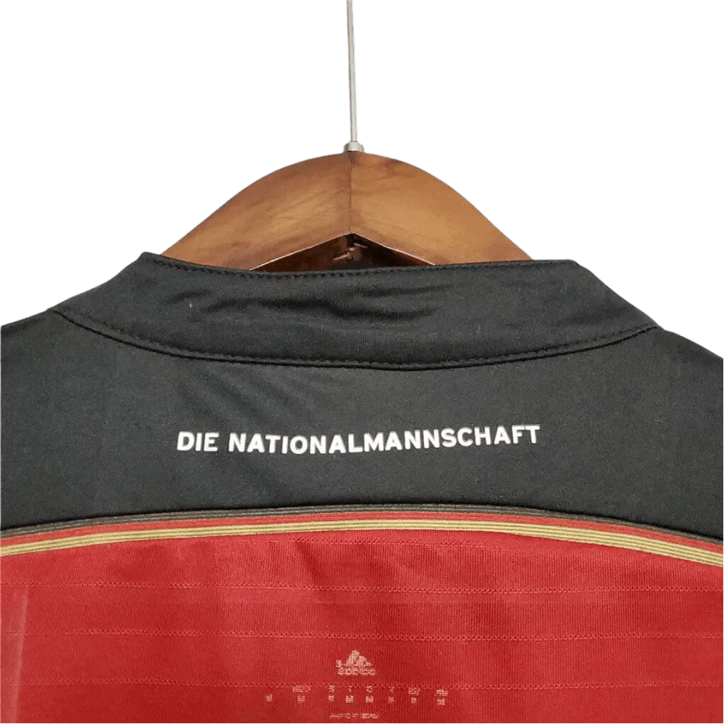 https://cdn.shopify.com/s/files/1/0826/7228/8075/files/2014-germany-away-black-red-retro-kit-786387.webp?v=1741197023