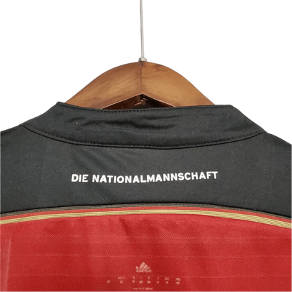 https://cdn.shopify.com/s/files/1/0826/7228/8075/files/2014-germany-away-black-red-retro-kit-786387.webp?v=1741197023