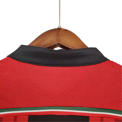 https://cdn.shopify.com/s/files/1/0826/7228/8075/files/20142015-ac-milan-fly-emirates-home-retro-kit-614755.webp?v=1741197279