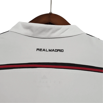 https://cdn.shopify.com/s/files/1/0826/7228/8075/files/20142015-real-madrid-fly-emirates-home-retro-kit-596589.webp?v=1741197449