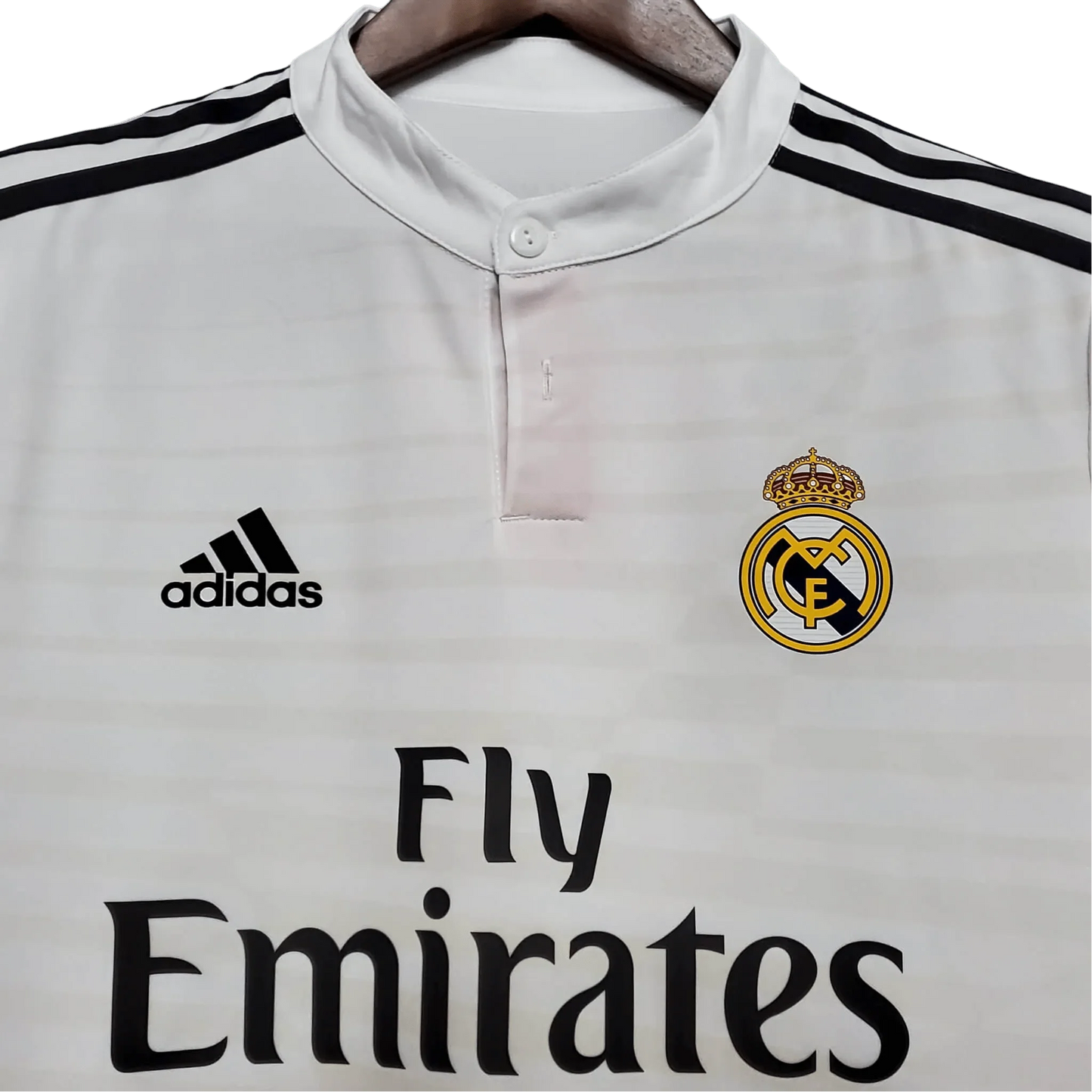 https://cdn.shopify.com/s/files/1/0826/7228/8075/files/20142015-real-madrid-fly-emirates-home-retro-kit-976904.webp?v=1741197450