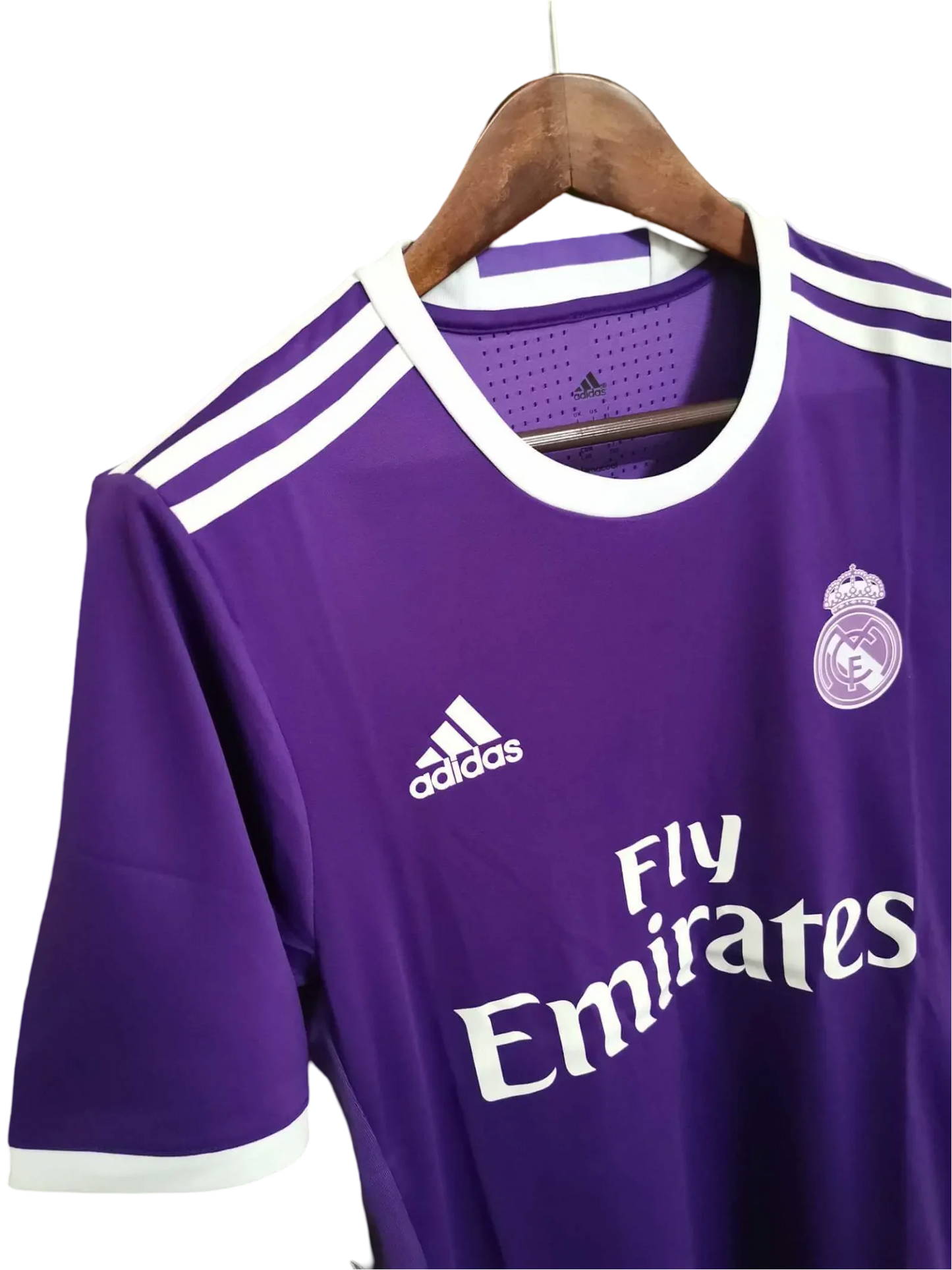 https://cdn.shopify.com/s/files/1/0826/7228/8075/files/20162017-real-madrid-fly-emirates-away-purple-retro-kit-625688.webp?v=1741197473