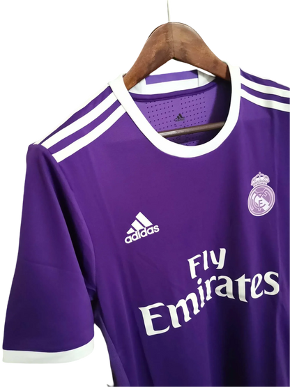 https://cdn.shopify.com/s/files/1/0826/7228/8075/files/20162017-real-madrid-fly-emirates-away-purple-retro-kit-625688.webp?v=1741197473