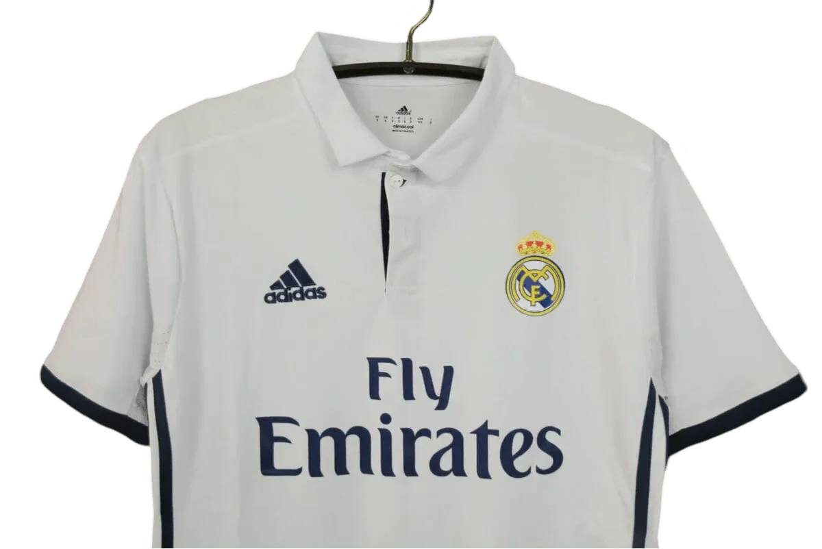 https://cdn.shopify.com/s/files/1/0826/7228/8075/files/20162017-real-madrid-fly-emirates-home-retro-kit-275413.webp?v=1741197453