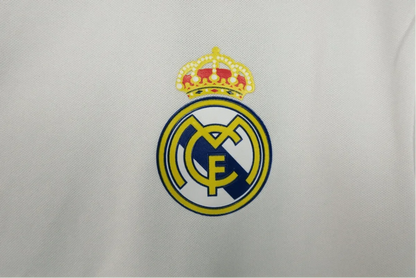 https://cdn.shopify.com/s/files/1/0826/7228/8075/files/20162017-real-madrid-fly-emirates-home-retro-kit-823859.webp?v=1741197451
