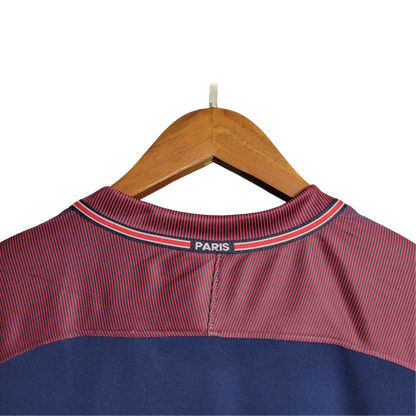 https://cdn.shopify.com/s/files/1/0826/7228/8075/files/20172018-paris-saint-germain-fly-emirates-home-retro-jersey-588803.webp?v=1741198007