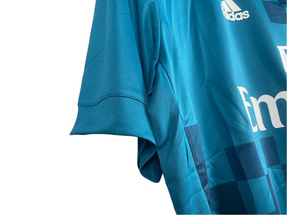 https://cdn.shopify.com/s/files/1/0826/7228/8075/files/20172018-real-madrid-fly-emirates-away-retro-kit-classickits433-741082.webp?v=1741198519