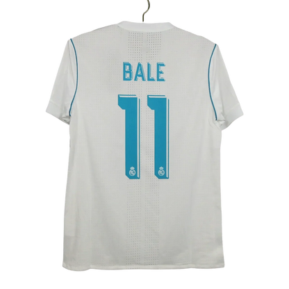 https://cdn.shopify.com/s/files/1/0826/7228/8075/files/20172018-real-madrid-fly-emirates-home-retro-kit-207180.webp?v=1741197466
