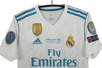 https://cdn.shopify.com/s/files/1/0826/7228/8075/files/20172018-real-madrid-fly-emirates-home-retro-kit-390237.webp?v=1741197468