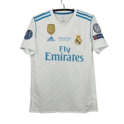 https://cdn.shopify.com/s/files/1/0826/7228/8075/files/20172018-real-madrid-fly-emirates-home-retro-kit-714980.webp?v=1741197467