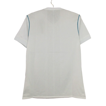 https://cdn.shopify.com/s/files/1/0826/7228/8075/files/20172018-real-madrid-fly-emirates-home-retro-kit-893719.webp?v=1741197466