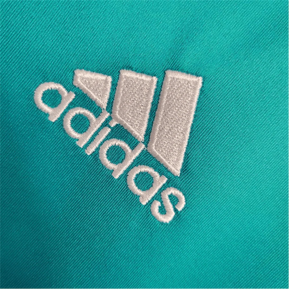 https://cdn.shopify.com/s/files/1/0826/7228/8075/files/20172018-real-madrid-fly-emirates-third-away-retro-kit-long-sleeves-189132.webp?v=1741197437