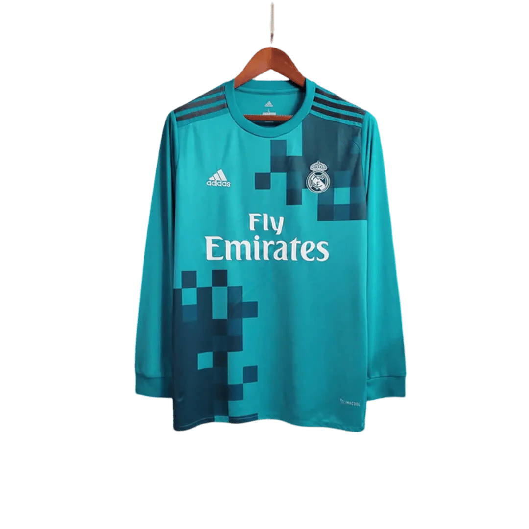 https://cdn.shopify.com/s/files/1/0826/7228/8075/files/20172018-real-madrid-fly-emirates-third-away-retro-kit-long-sleeves-276062.webp?v=1741197436