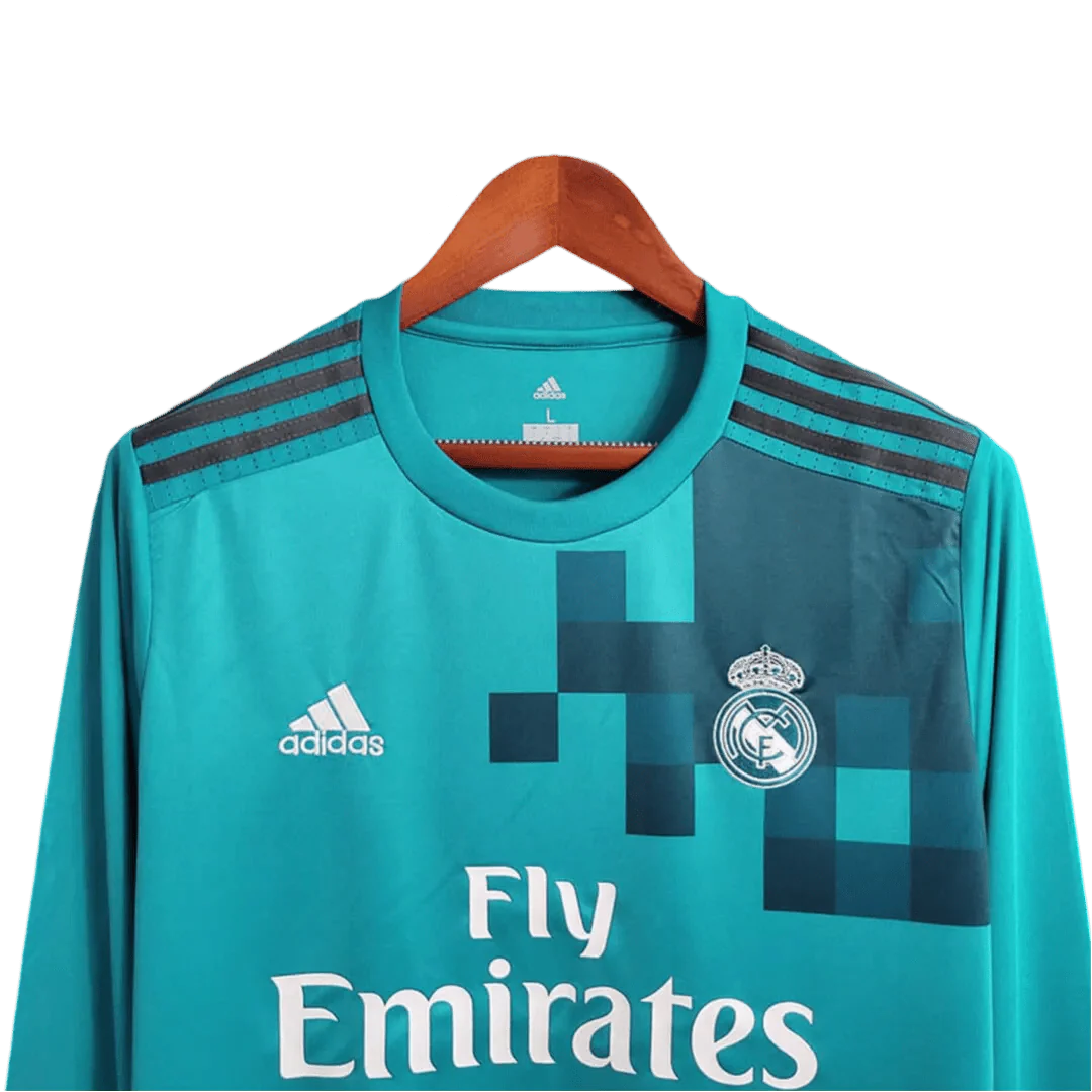 https://cdn.shopify.com/s/files/1/0826/7228/8075/files/20172018-real-madrid-fly-emirates-third-away-retro-kit-long-sleeves-291680.webp?v=1741197436