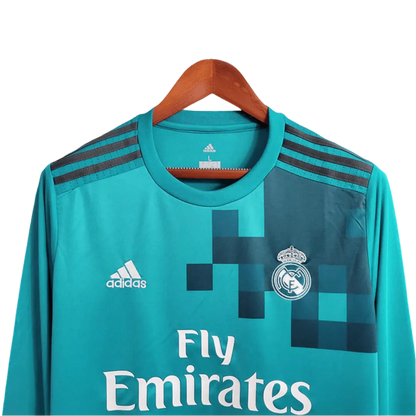 https://cdn.shopify.com/s/files/1/0826/7228/8075/files/20172018-real-madrid-fly-emirates-third-away-retro-kit-long-sleeves-291680.webp?v=1741197436