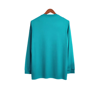 https://cdn.shopify.com/s/files/1/0826/7228/8075/files/20172018-real-madrid-fly-emirates-third-away-retro-kit-long-sleeves-660406.webp?v=1741197437