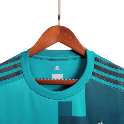 https://cdn.shopify.com/s/files/1/0826/7228/8075/files/20172018-real-madrid-fly-emirates-third-away-retro-kit-long-sleeves-888813.webp?v=1741197437