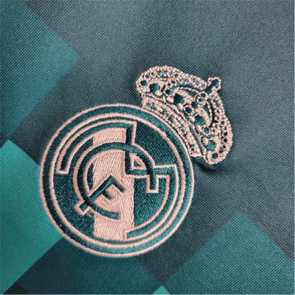 https://cdn.shopify.com/s/files/1/0826/7228/8075/files/20172018-real-madrid-fly-emirates-third-away-retro-kit-long-sleeves-942088.webp?v=1741197438