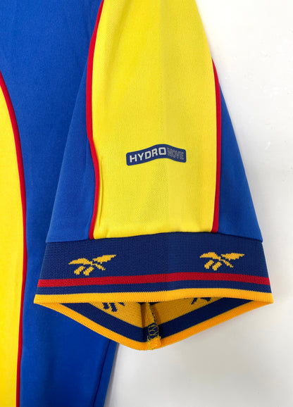 https://cdn.shopify.com/s/files/1/0891/1768/8155/files/Colombiahomeshirt-2001-sleeve.jpg?v=1740564389