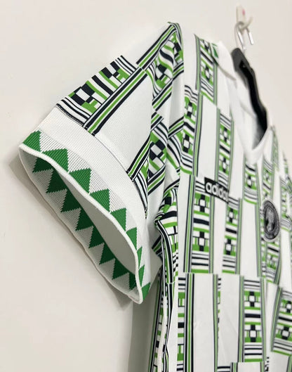 https://cdn.shopify.com/s/files/1/0891/1768/8155/files/Nigeriaawayshirt1994-detail.jpg?v=1740564272