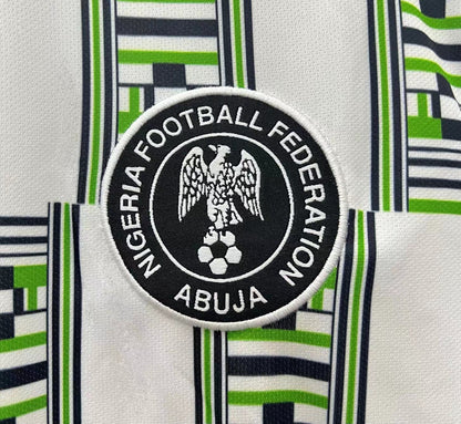 https://cdn.shopify.com/s/files/1/0891/1768/8155/files/Nigeriaawayshirt1994-logo.jpg?v=1740564272