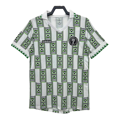 https://cdn.shopify.com/s/files/1/0891/1768/8155/files/Nigeriaawayshirt1994.png?v=1740564272