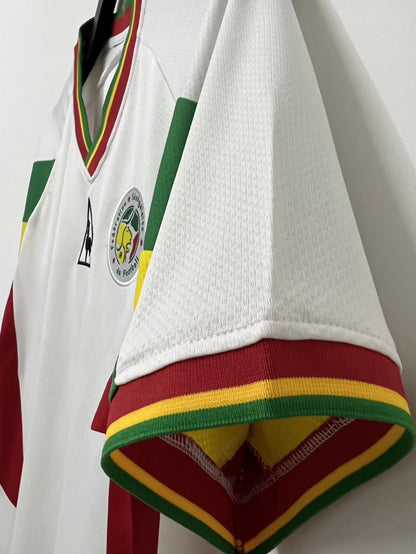 https://cdn.shopify.com/s/files/1/0891/1768/8155/files/SenegalHomeShirt-2002-detail.jpg?v=1740564467